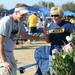 Michigan fans Tim Talbott, of Naples, Fla., and Jan Donaldson, of Fort Myers, Fla., joke around near a Christmas tree filled with empty bottle ornaments outside of Raymond James Stadium before the start of the Outback Bowl in Tampa, Fla. on Tuesday, Jan. 1. Melanie Maxwell I AnnArbor.com
